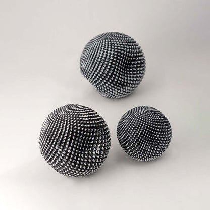 Black textured decorative ball set with woven pattern for modern tabletop styling and minimalist home decor.