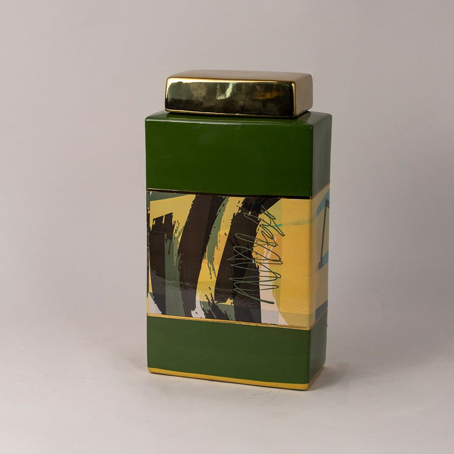 Side angle view of green abstract jar showing smooth glossy surface and artistic paint strokes.