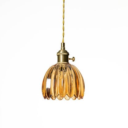 Amber textured glass pendant light with scalloped design crafted for sophisticated modern interiors.