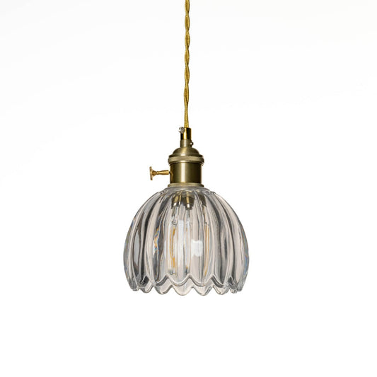Clear ribbed glass pendant light with polished gold fittings designed for elegant modern spaces.