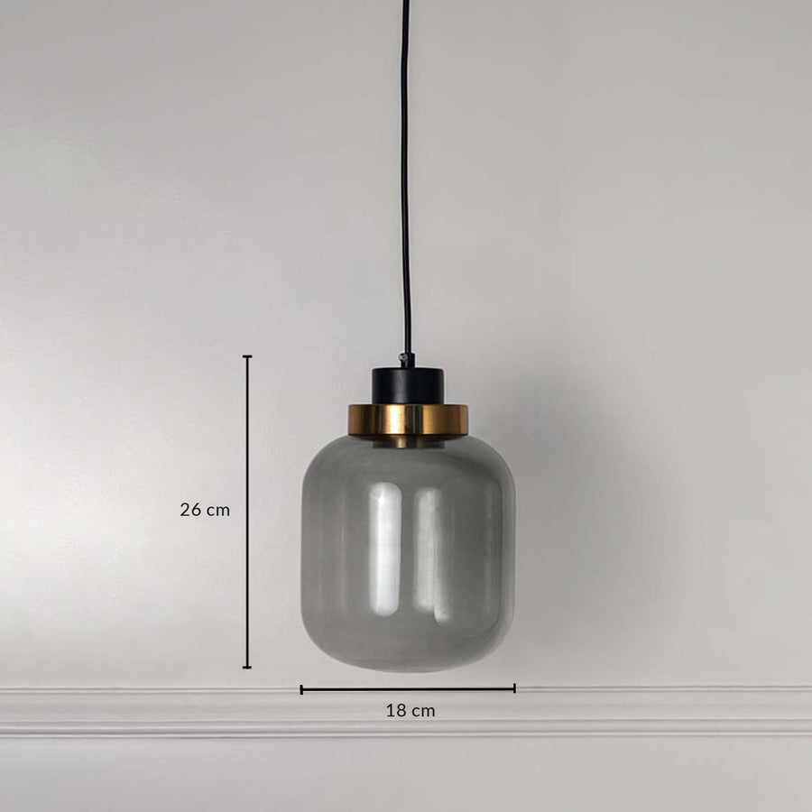 Smoked glass pendant light with golden detail measured 26x18 cm modern hanging lamp for dining table and living room decor.