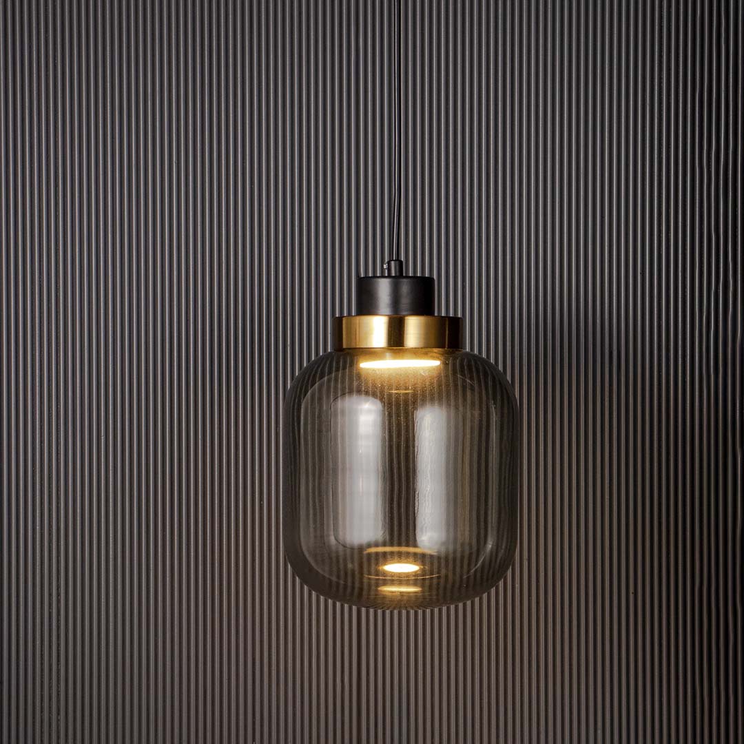 Elegant smoked glass hanging pendant light with golden accent modern ceiling lamp for dining area and living room decor.