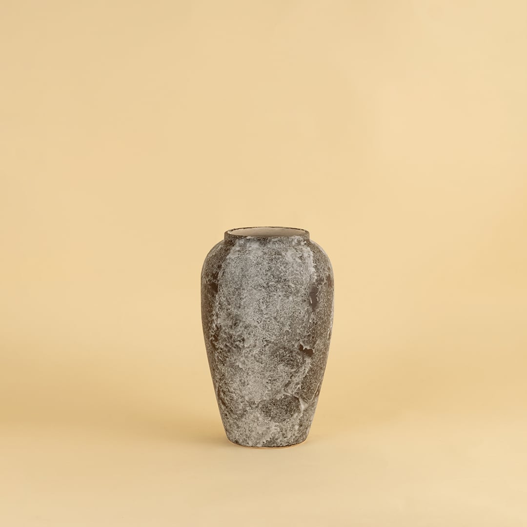 Rustic ceramic vase in grey brown textured stone look ideal for enhancing living room and entryway decor.
