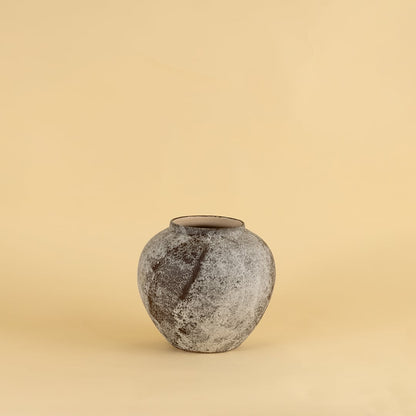 Round rustic ceramic vase with grey and brown textured finish ideal for modern and traditional interiors.