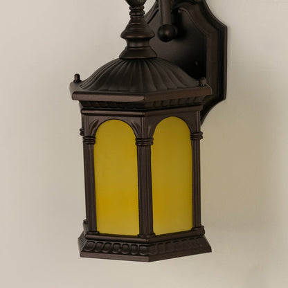 Closeup view of the large black metal outdoor lantern showing the detailed frame and the texture of the clear ribbed glass panels.