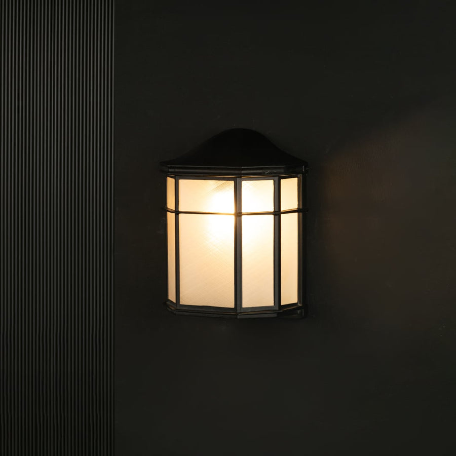 Outdoor wall light with black metal frame and frosted glass panels shown against a black background for clear visibility.