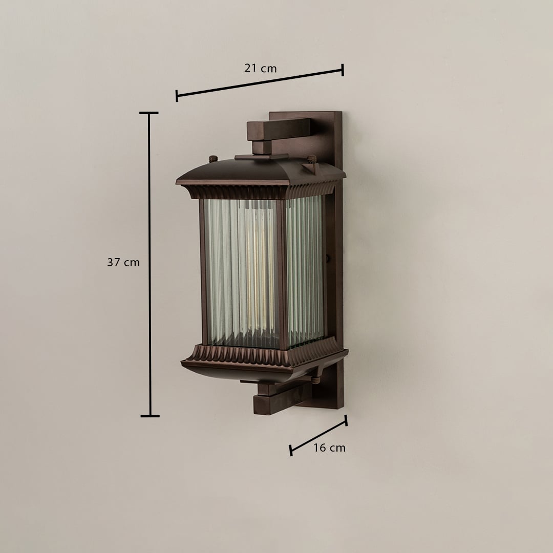 A bronze outdoor wall lantern with ribbed glass shown with dimensions clearly marked as 37 cm height 21 cm width and 16 cm depth against a plain background.