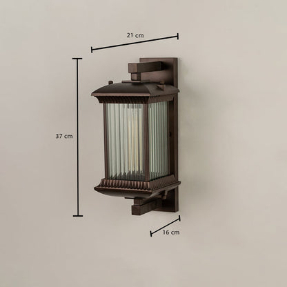 A bronze outdoor wall lantern with ribbed glass shown with dimensions clearly marked as 37 cm height 21 cm width and 16 cm depth against a plain background.