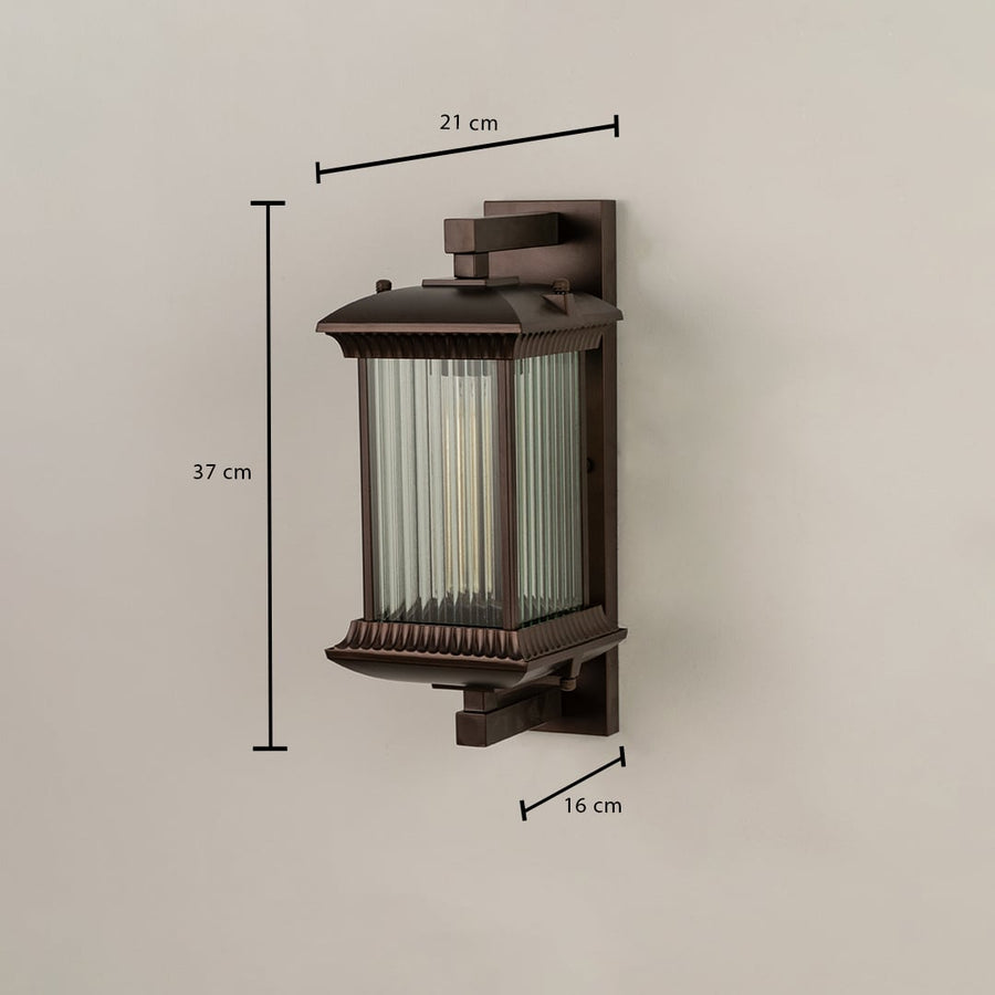 A bronze outdoor wall lantern with ribbed glass shown with dimensions clearly marked as 37 cm height 21 cm width and 16 cm depth against a plain background.