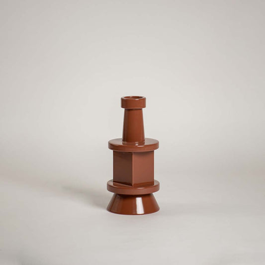 Brown sculptural vase displayed against a plain white background showcasing its modern tiered silhouette and glossy finish for a clean minimal decorative style.