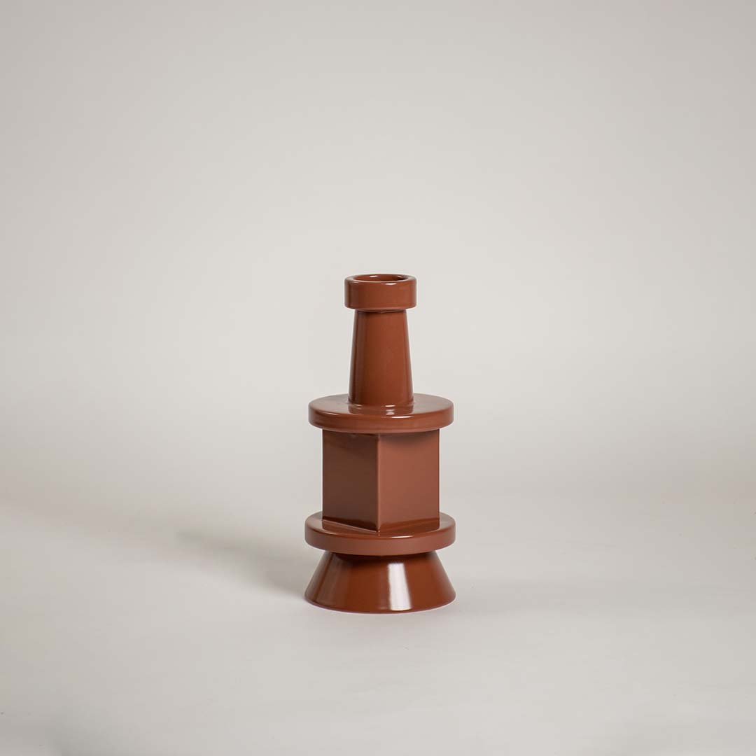 Brown sculptural vase displayed against a plain white background showcasing its modern tiered silhouette and glossy finish for a clean minimal decorative style.