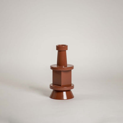 Brown sculptural vase displayed against a plain white background showcasing its modern tiered silhouette and glossy finish for a clean minimal decorative style.