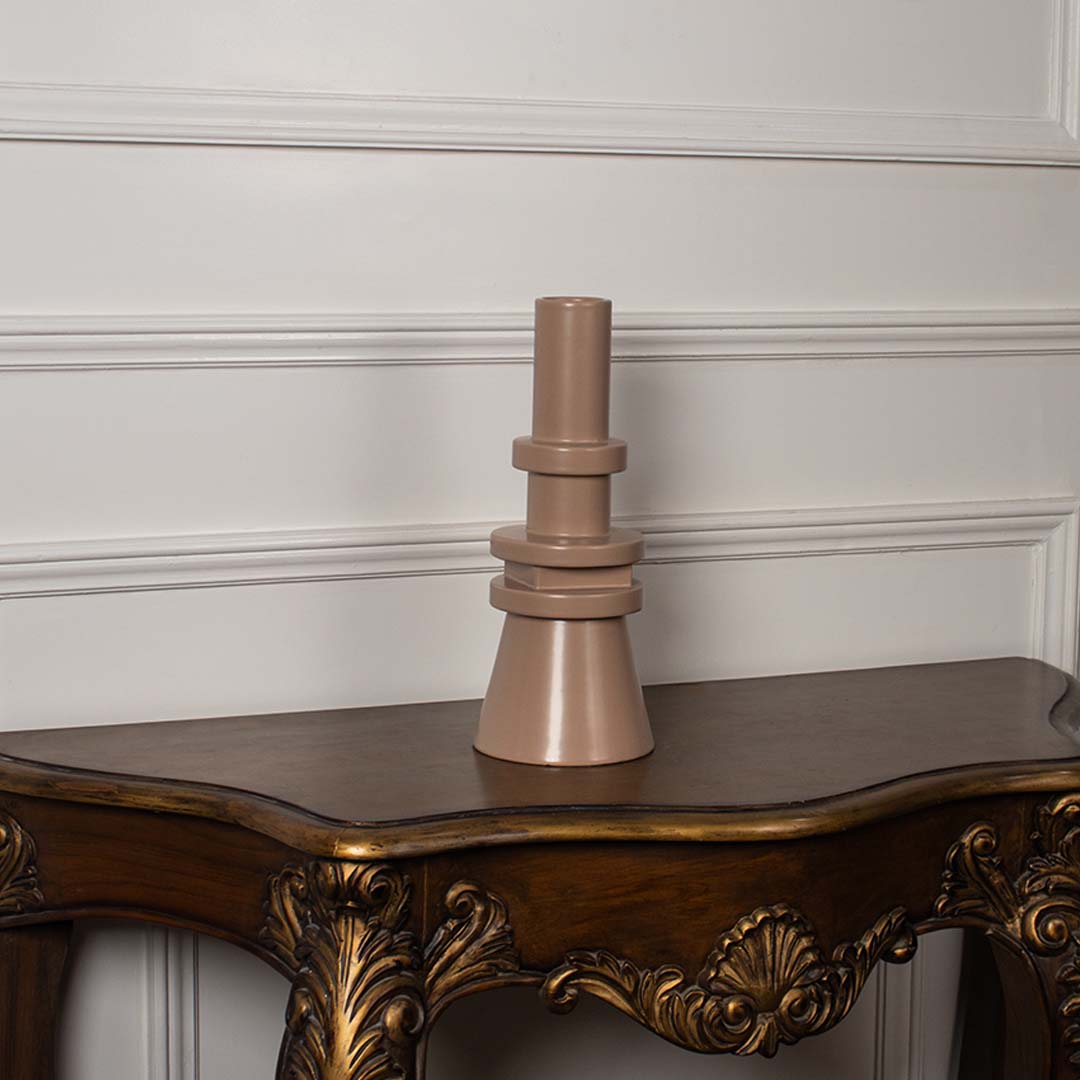 Minimal beige vase on a white background featuring its elegant sculptural design and layered geometric details that create a bold yet refined decorative accent.