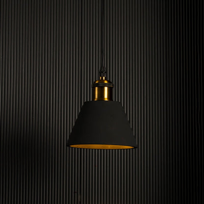Black cone pendant lamp glowing brightly against a dark background highlighting its elegant modern shape.