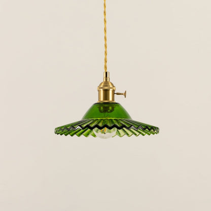 Green fluted metal pendant light with decorative scalloped edges crafted for dining and living spaces.