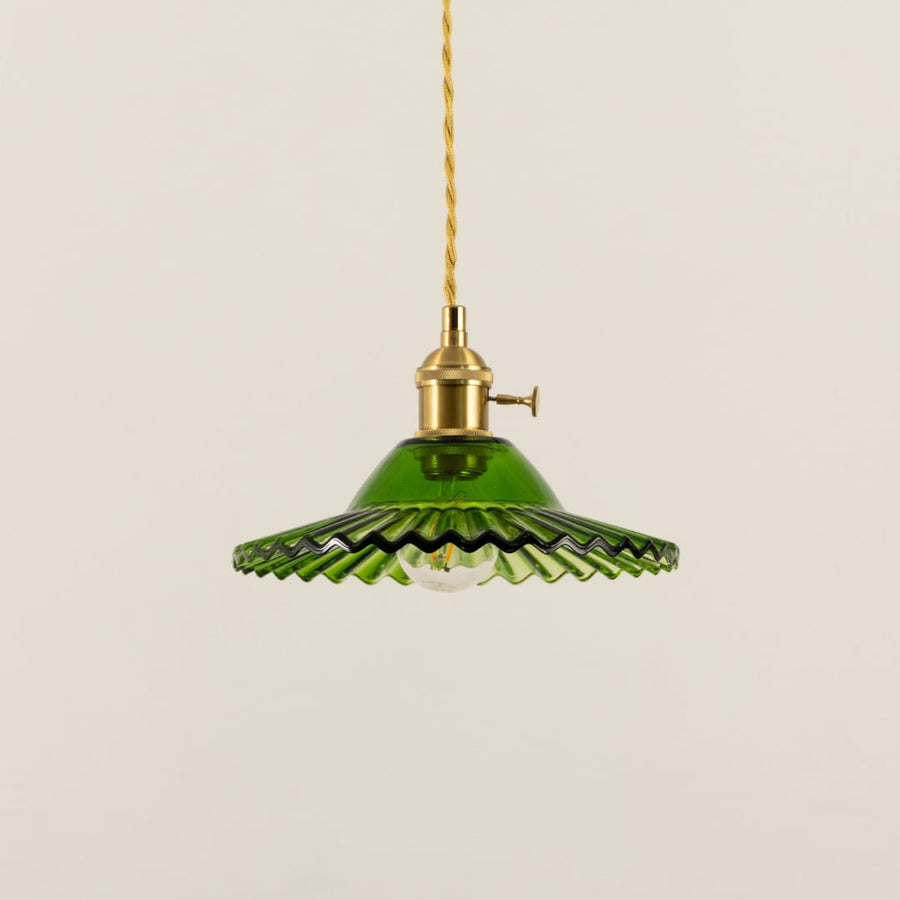 Green fluted metal pendant light with decorative scalloped edges crafted for dining and living spaces.