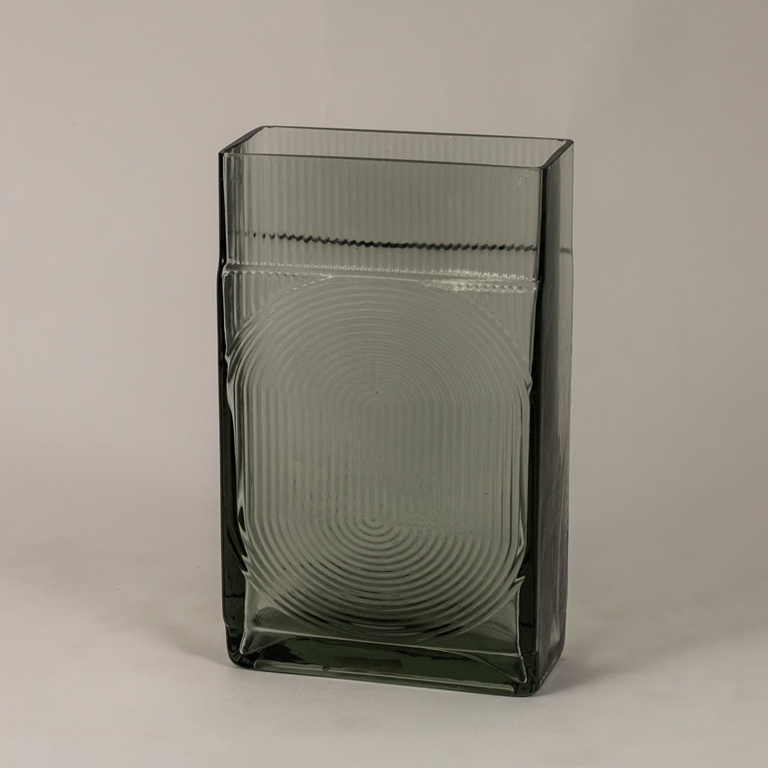 Side view of smoky gray textured glass vase highlighting its rectangular structure and reflective modern finish.