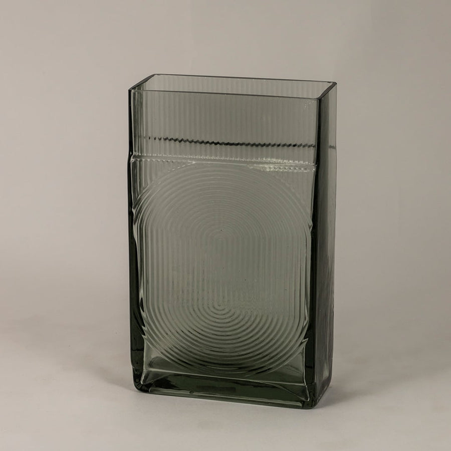 Side view of smoky gray textured glass vase highlighting its rectangular structure and reflective modern finish.