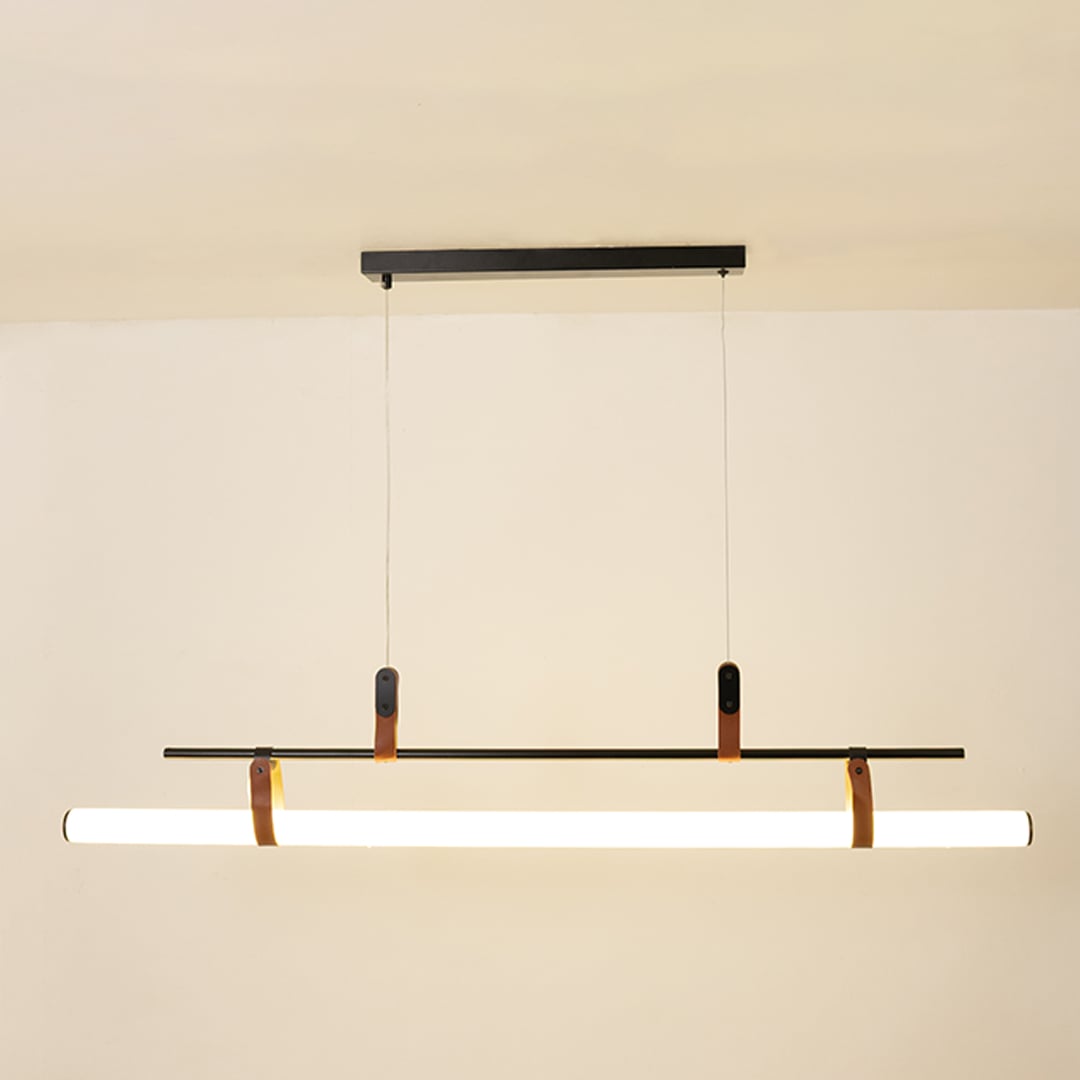 Black metal linear LED pendant light with integrated illumination creating sleek modern ambient ceiling lighting indoors.