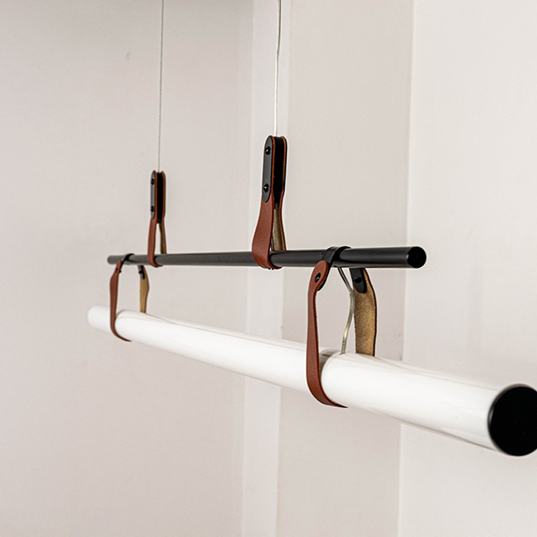 Black metal linear LED pendant light showcasing premium metal craftsmanship and frosted diffuser detailing for interiors.