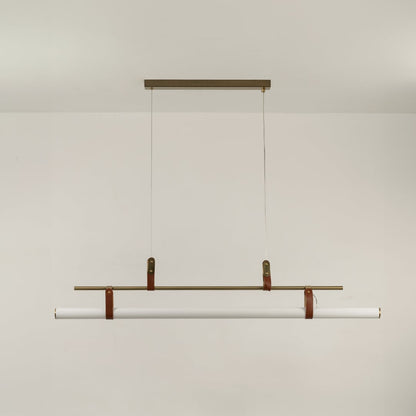 Gold linear pendant light on a white background with the light off highlighting its slim sculptural minimal design.