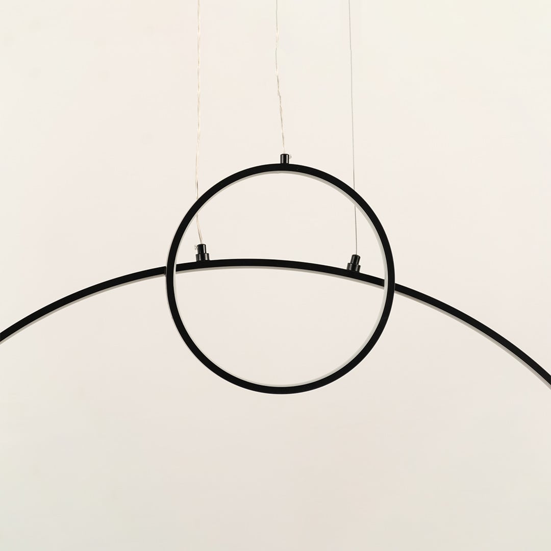 A modern black ring ceiling light featuring a clean curved bar ideal for minimal LED lighting and contemporary designer ceiling décor in stylish interiors.