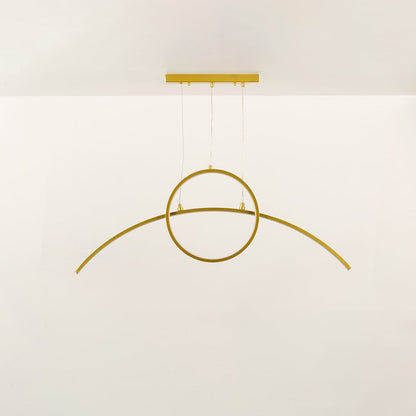 Minimal gold metal wall light with curved linear design shown unlit on black background for modern architectural lighting decor.