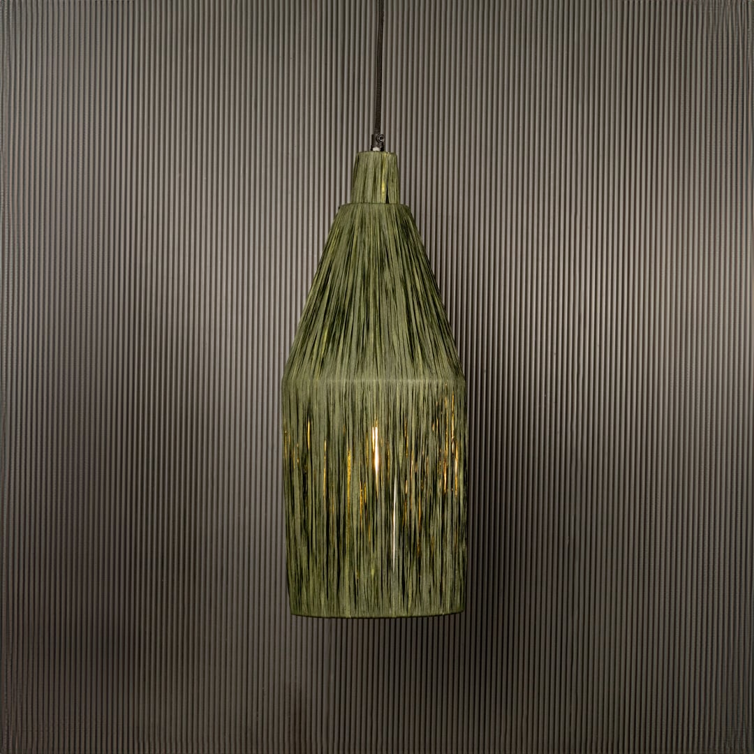 Green ribbed glass pendant light illuminated warmly adding vintage charm to indoor spaces.