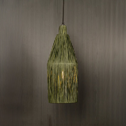 Green ribbed glass pendant light illuminated warmly adding vintage charm to indoor spaces.