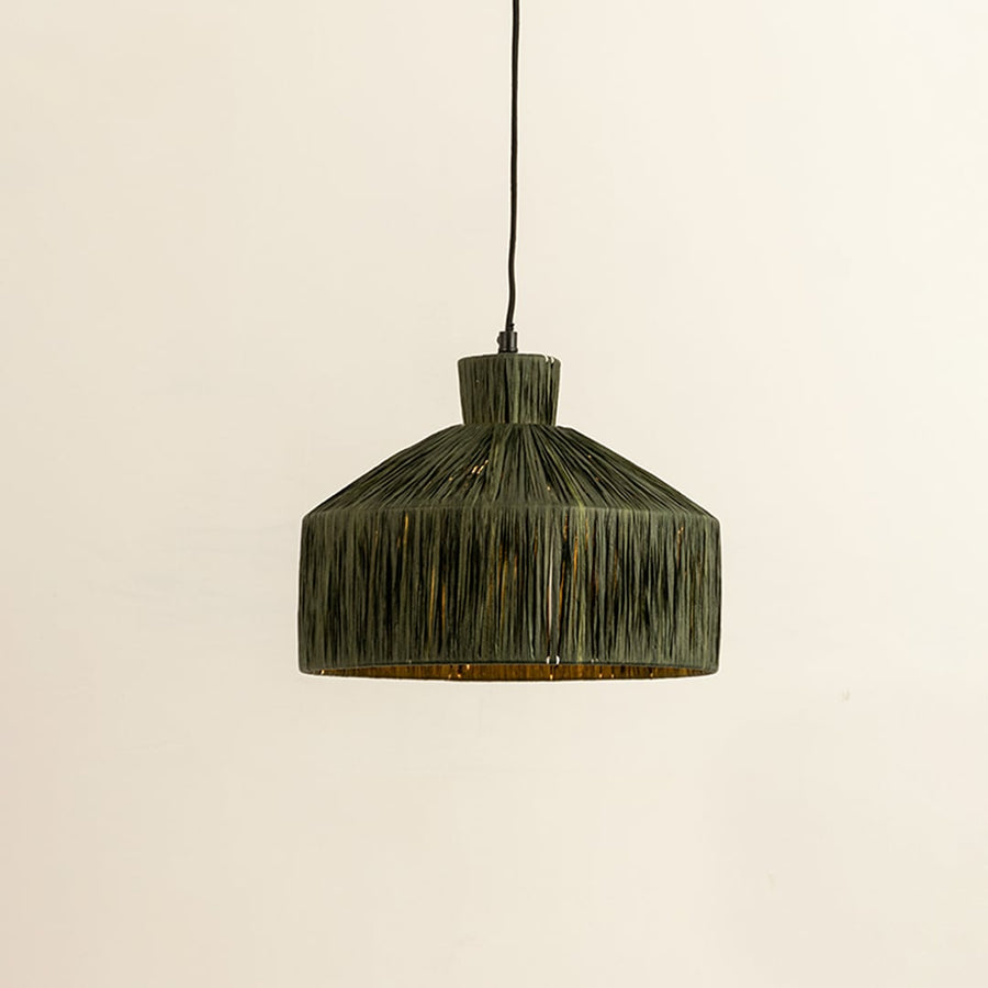 Green woven fiber pendant light illuminated to showcase organic decorative ceiling lighting with artisanal appeal.