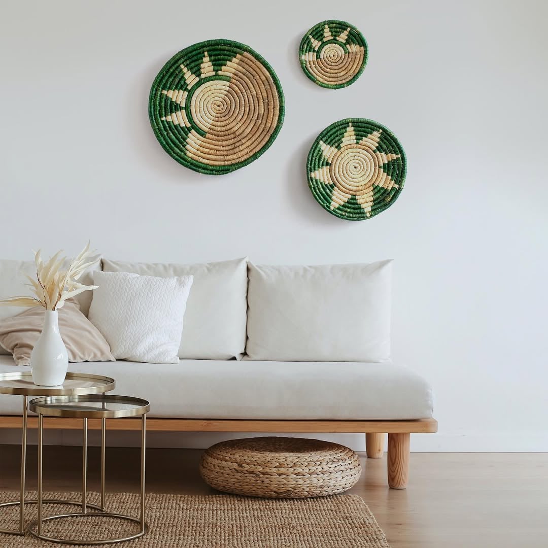 Green and beige bamboo wall plates displayed above cream sofa adding rustic charm to modern minimalist living room.