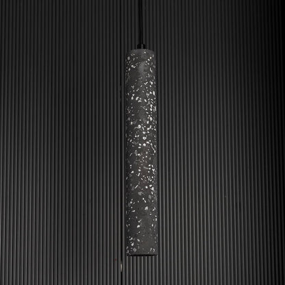 Amber glass pendant light unlit against black background showcasing soft amber tone and reflective finish.