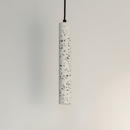 Cylindrical terrazzo pendant light with white stone texture and black accents for stylish interiors.