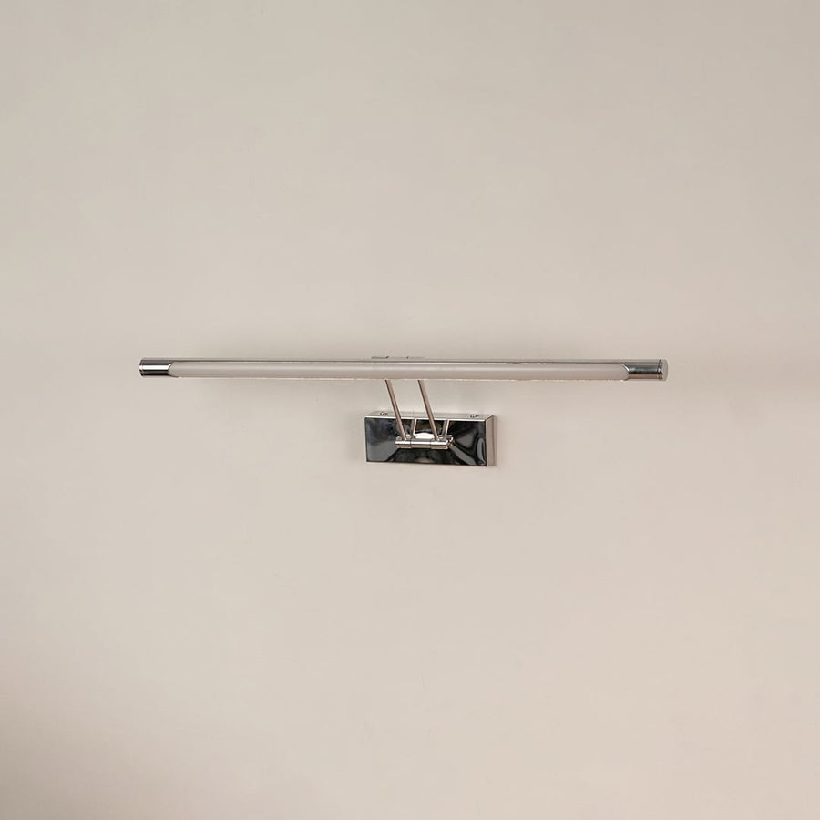Chrome picture light with LED bar switched off on white background showcasing modern wall decor lighting design.