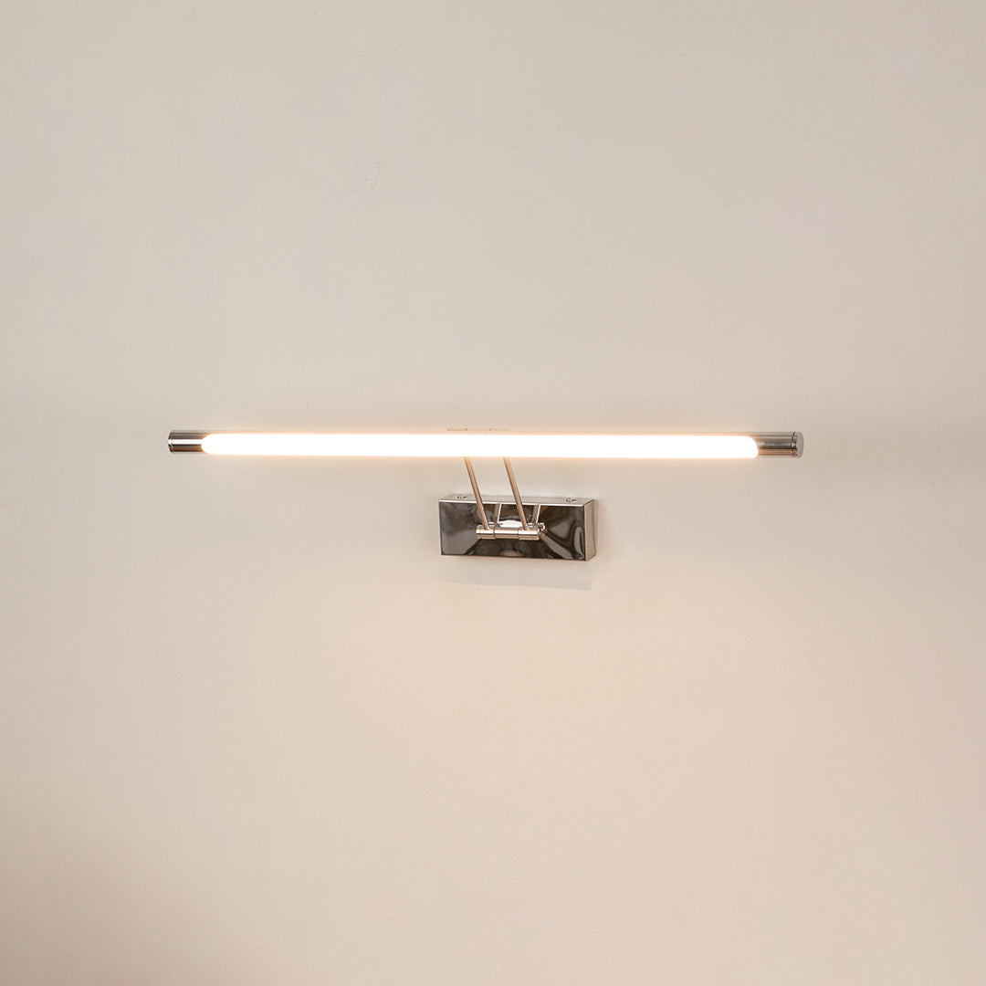 Elegant wall light in chrome metal finish with linear bar design for bathroom or vanity decor lighting white background.