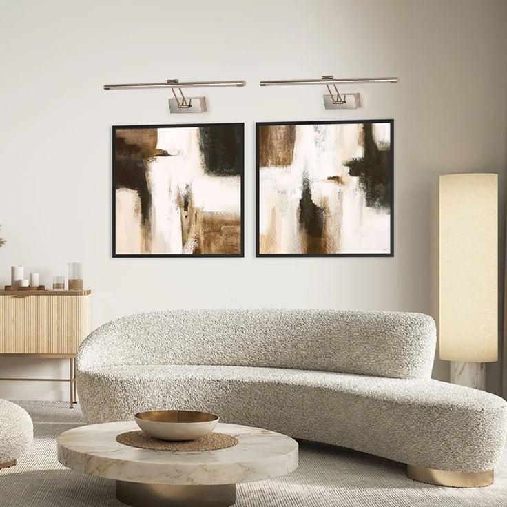 Elegant silver picture light enhancing modern wall decor with sleek metal finish ideal for living room and hallway lighting.