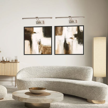 Elegant silver picture light enhancing modern wall decor with sleek metal finish ideal for living room and hallway lighting.