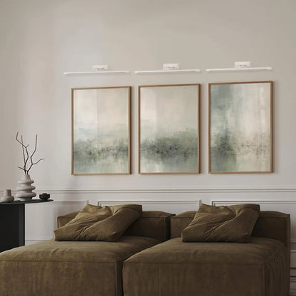 Elegant white metal picture light enhancing wall decor with soft illumination for modern living spaces.