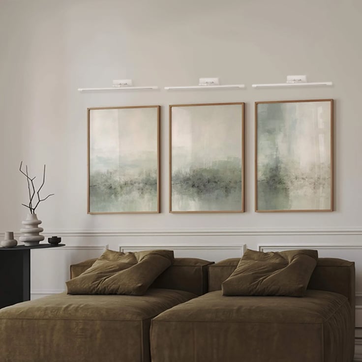 Elegant white metal picture light enhancing wall decor with soft illumination for modern living spaces.