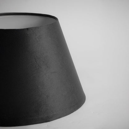 Closeup view of the black tapered lampshade showing the rich fabric texture and smooth finish on a white background for a clear detailed product presentation.