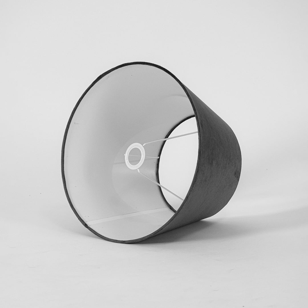 Black tapered lampshade displayed on a clean white background showing its smooth fabric texture and wide base for a modern elegant decorative lighting style.
