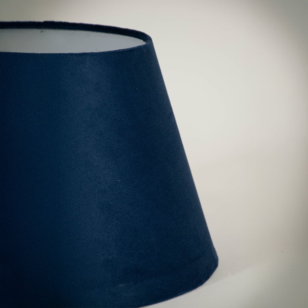 Closeup view of the blue tapered lampshade showing its rich fabric texture and precise finish for a clear detailed product presentation.