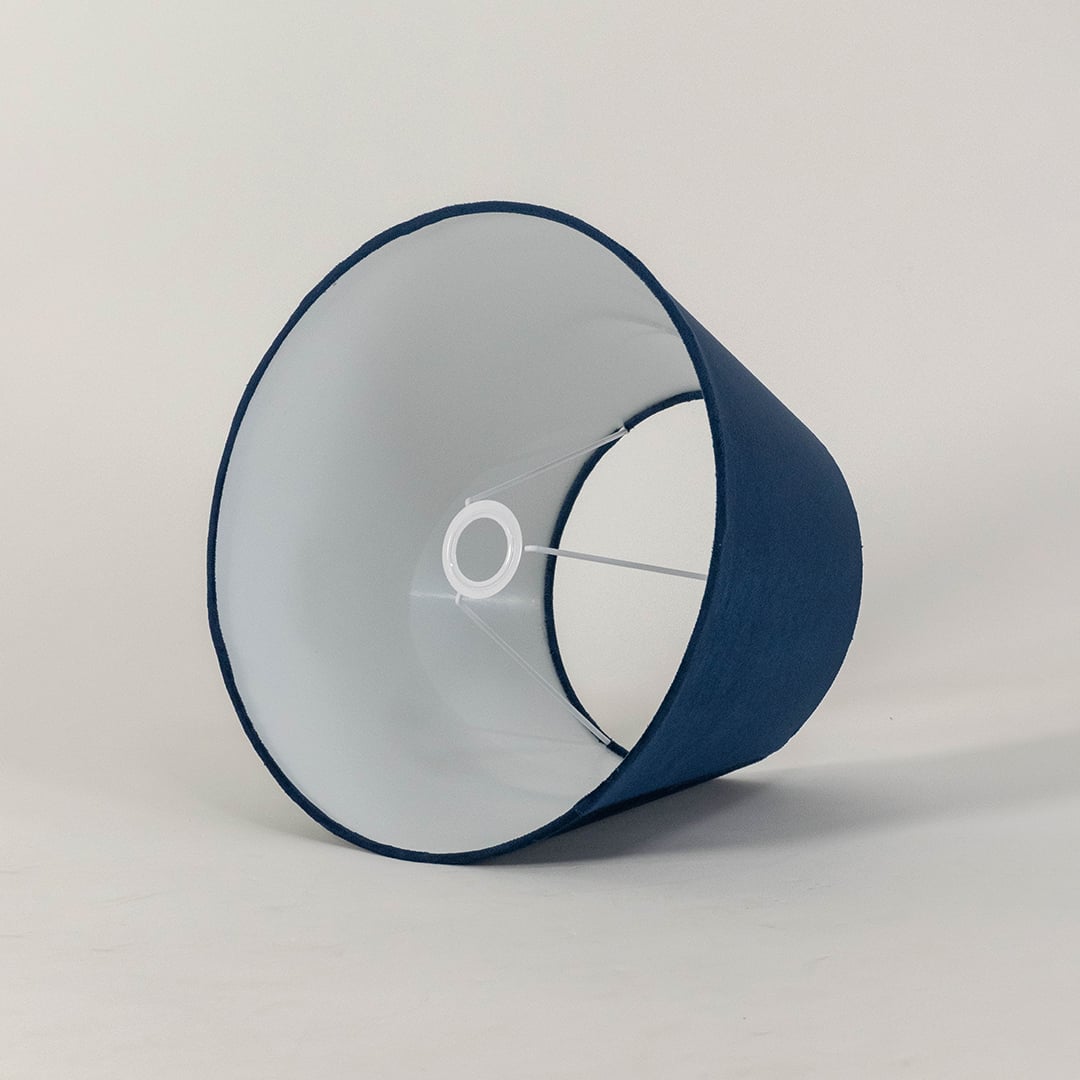 Blue tapered lampshade displayed on a clean white background highlighting its smooth fabric texture and wide shape for modern lighting.