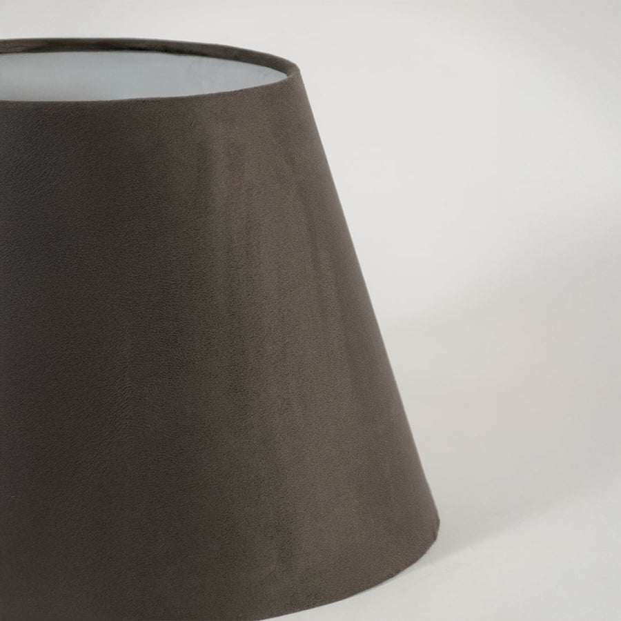Closeup view of the brown tapered lampshade showing its velvet texture and fine detailing for a clear and refined product presentation.
