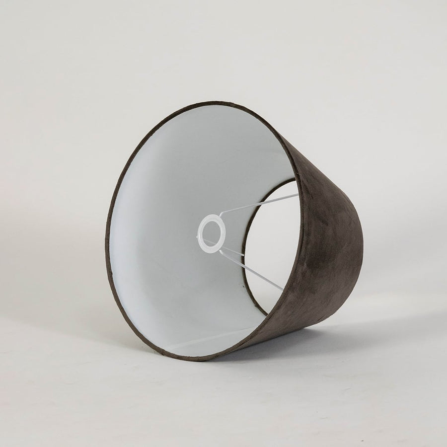 Brown tapered lampshade displayed on a clean white background highlighting its smooth fabric texture and classic wide base shape.