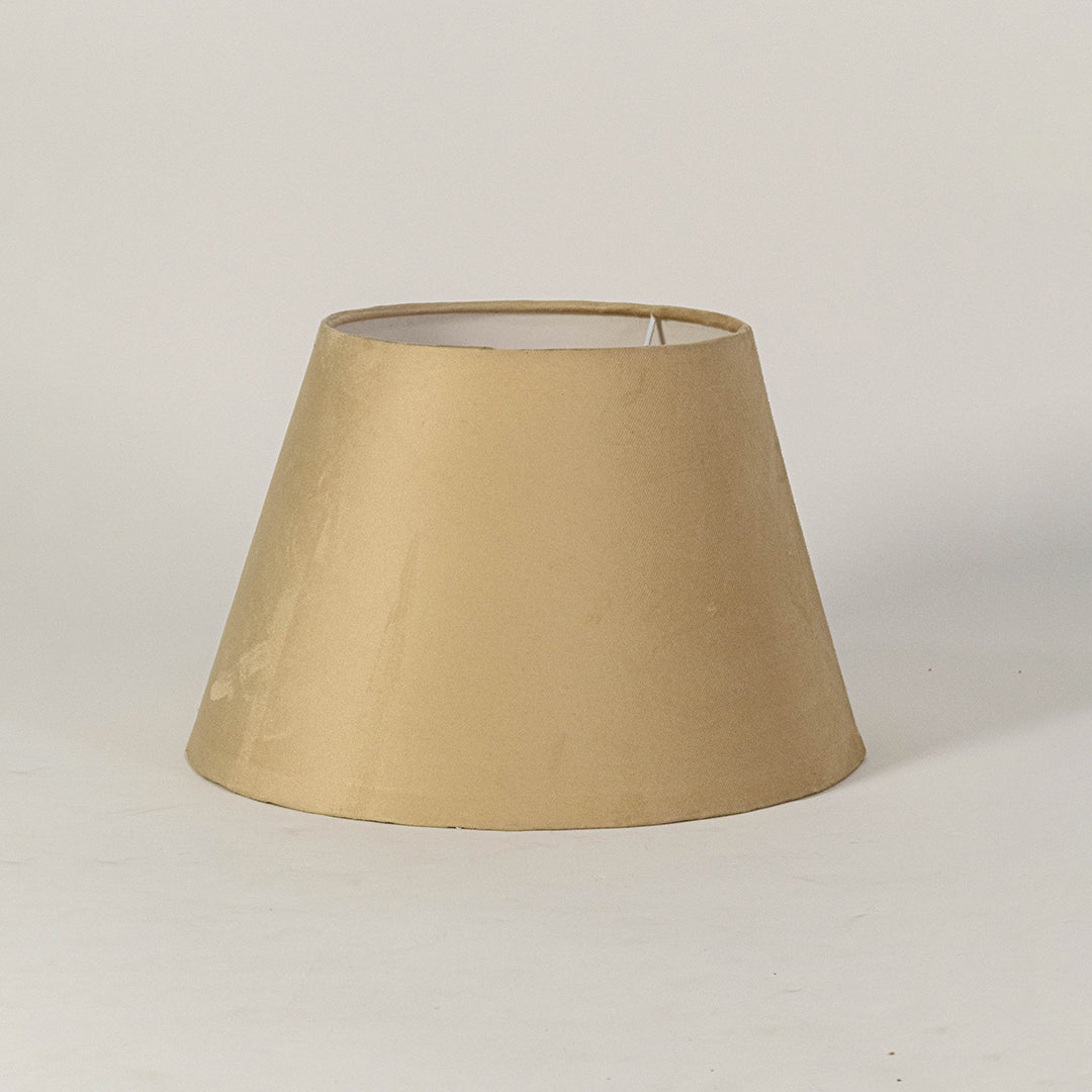 Elegant fabric lampshade in beige finish for table or floor lamp soft lighting and home decor placement white background.

