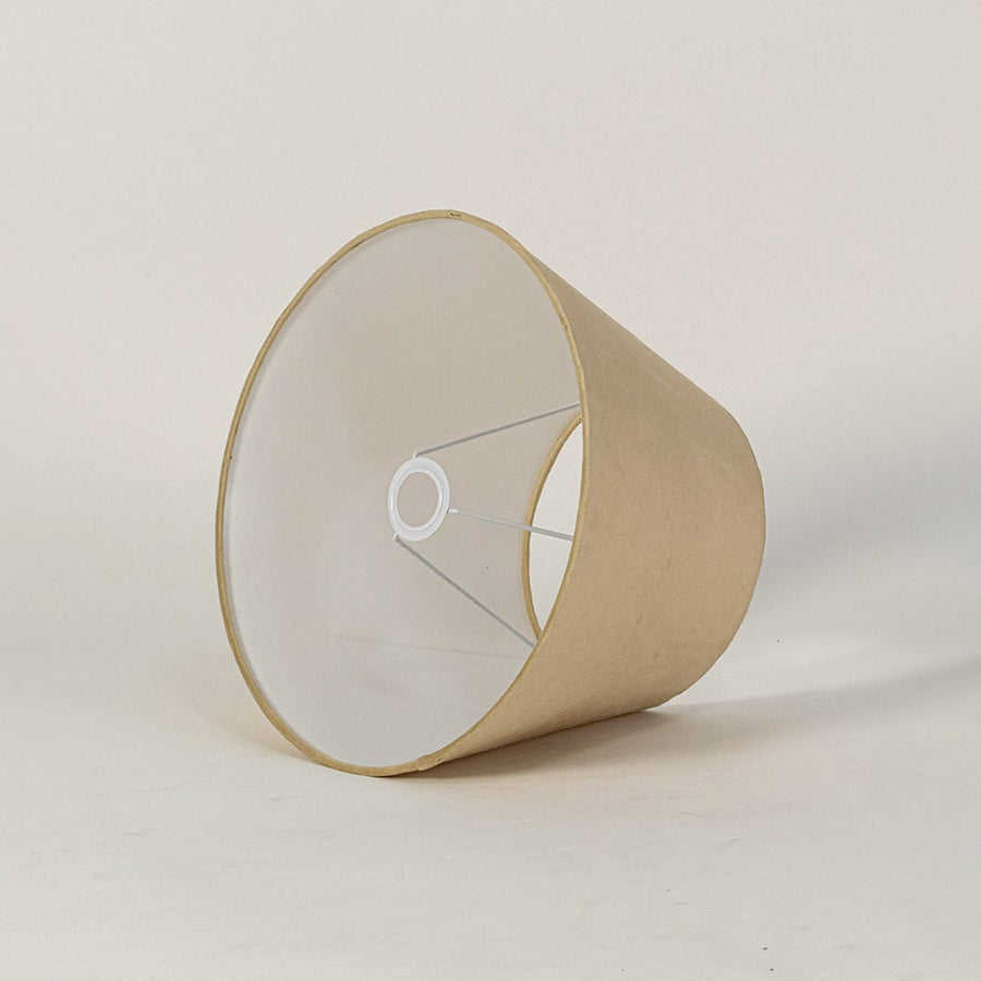 Beige tapered lampshade displayed on a clean white background highlighting its smooth fabric texture and wide base for a warm modern decorative lighting look.