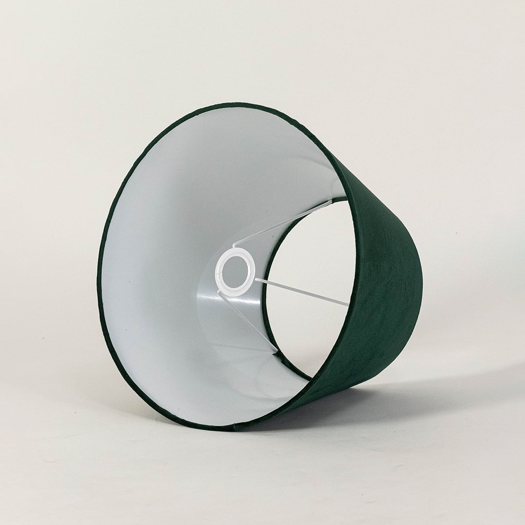Green tapered lampshade displayed on a clean white background highlighting its soft fabric texture and wide shape for modern lighting.