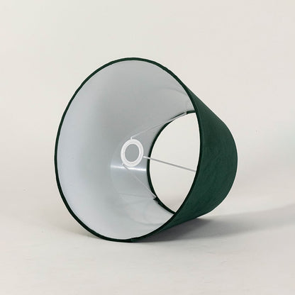 Green tapered lampshade displayed on a clean white background highlighting its soft fabric texture and wide shape for modern lighting.