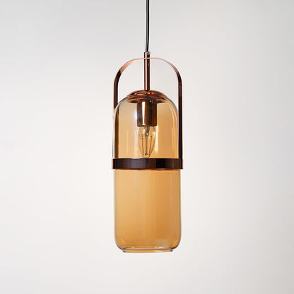 Amber glass pendant lamp in golden frame shown off on plain white background highlights elegant modern design.